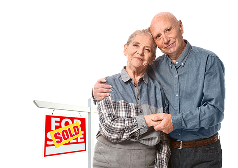 Couple standing in front of sold sign